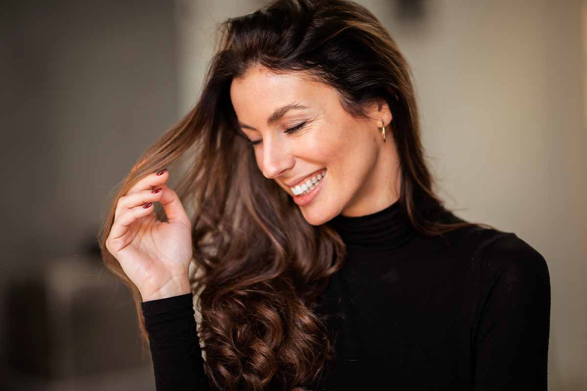 a woman smiling after getting functional rhinoplasty in Chicago.